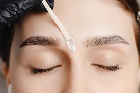 Waxing eyebrows